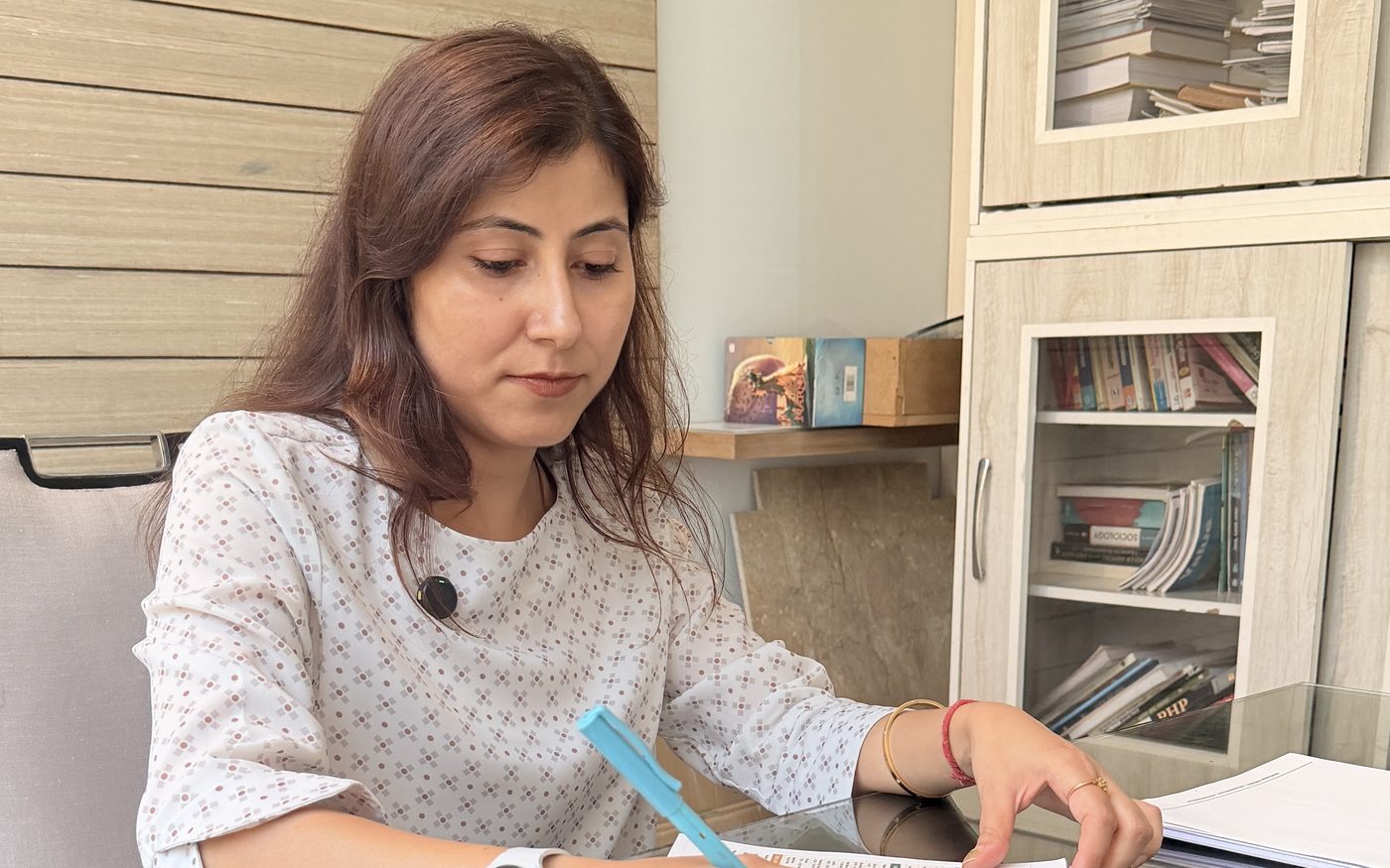 Shilpa Koundal writing a diet plan at the Nutrimenters clinic, Sector 143, Noida